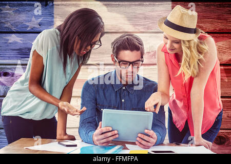 Composite image of creative business team working hard together Stock Photo