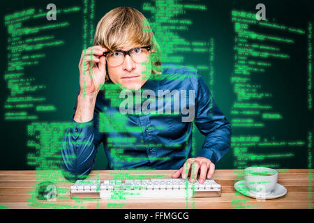 Composite image of focused hipster businessman using computer Stock Photo