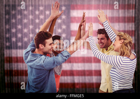 Composite image of happy creative team giving high fives to each other Stock Photo