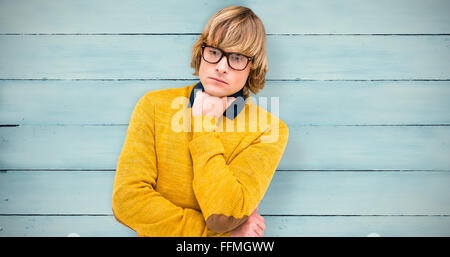 Composite image of portrait of thoughtful hipster businessman with hand on chin Stock Photo