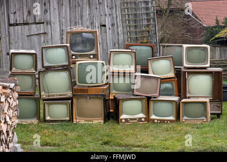 broadcast, television, old German  television set, stack in the meadow, television sets of Neckermann, Saba, Graetz, Philips, Nordmende, Wega, from the 1950s and 1960s, Additional-Rights-Clearences-Not Available Stock Photo