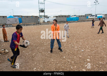 children playing football in Salarara refugee camp, Iraq Stock Photo