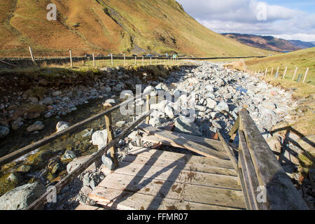 Storm Desmond wreaked havoc across Cumbria with floods and destruction, here a footbridge has been swept sideways and destroyed Stock Photo