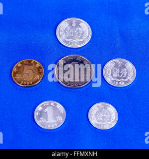 set of Chinese coins on a blue background Stock Photo