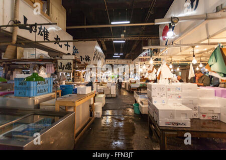 TOKYO - MAY 11: Shoppers visit Tsukiji Fish Market on May 11, 2014 in Tokyo. It is the biggest wholesale fish and seafood market Stock Photo