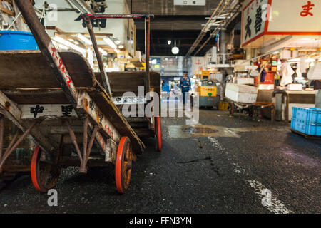 TOKYO - MAY 11: Shoppers visit Tsukiji Fish Market on May 11, 2014 in Tokyo. It is the biggest wholesale fish and seafood market Stock Photo