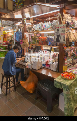 Shop owner making bags on a stall inside Central Market, Kuala Lumpur, Malaysia, Southeast Asia Stock Photo