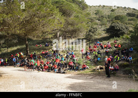 Group of hikers resting on mountain slope, Mijas, Spain. Stock Photo