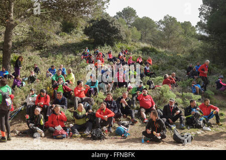 Group of hikers resting on mountain slope, Mijas, Spain. Stock Photo