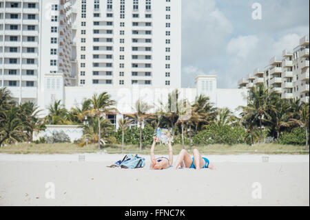 Miami Beach, Florida - People relaxing on the main beach, April Stock Photo