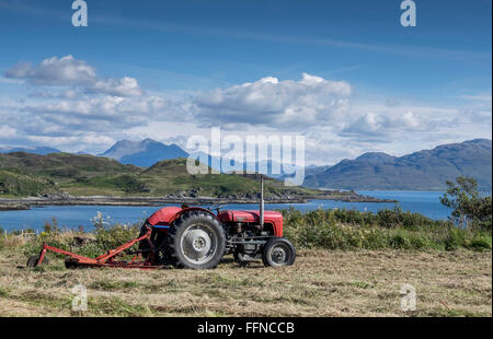 massey ferguson 135 red tractor haymaking at sleat Stock Photo