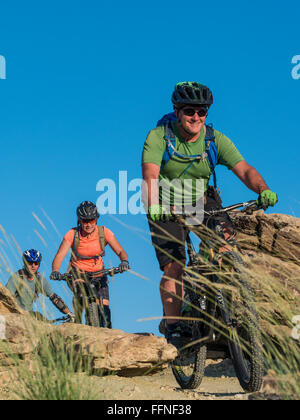 Woman mountain bikes a trail, Lunch Loop Trailhead, Grand Junction ...