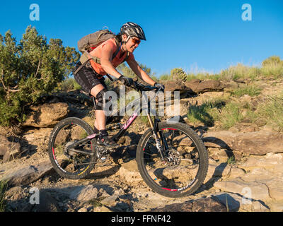 Woman mountain bikes a trail, Lunch Loop Trailhead, Grand Junction ...