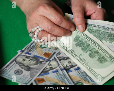 Female hands counting cash Stock Photo