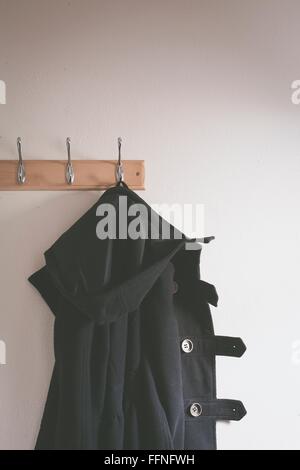 Detail of a duffle coat on a hanger Stock Photo