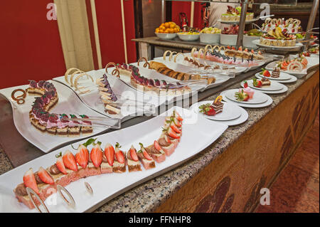 Selection of sweet desserts on display at a luxury restaurant buffet bar Stock Photo