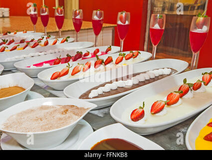 Selection of sweet desserts on display at a luxury restaurant buffet bar Stock Photo