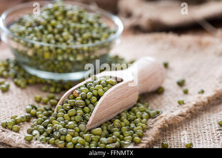 Some Mung Beans on an old wooden table (close-up shot) Stock Photo