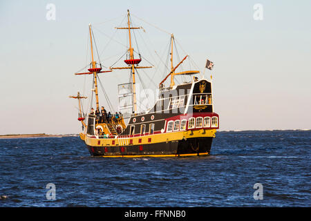 Rsembling a 16th century pirate ship, Black Raven is a popular excursion vessel operating from City Marina, St. Augustine, FL Stock Photo