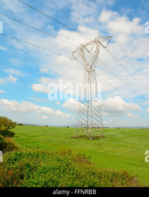 A landscape with a transmission tower under a cloudy sky Stock Photo ...