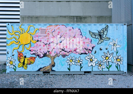 Colourful spring themed mural on a large metal container Stock Photo