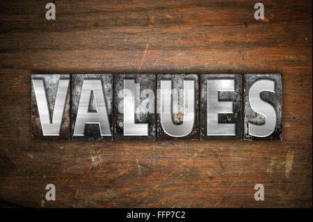 The word "Values" written in vintage metal letterpress type on an aged wooden background. Stock Photo