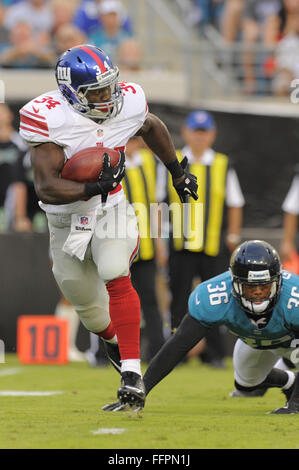 Jacksonville, FL, USA. 10th Aug, 2012. New York Giants running back David Wilson (34) runs upfield during the Gaints NFL preseason game against the Jacksonville Jaguars at EverBank Field on August 10, 2012 in Jacksonville, Florida. ZUMA Press/Scott A. Miller. © Scott A. Miller/ZUMA Wire/Alamy Live News Stock Photo