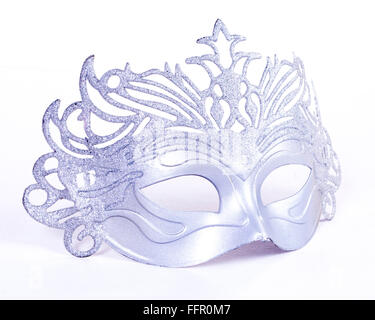 a silver mask placed over white background Stock Photo