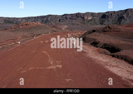 Road through volcanic landscape, lava, La Plaine des Sable, volcanic area at Piton de la Fournaise, Réunion National Park Stock Photo