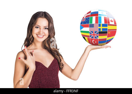 Business woman holds ball with many different countries flags isolated on white Stock Photo
