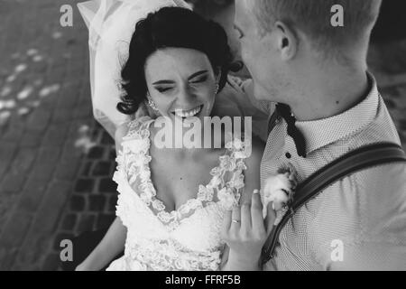 Bride and groom having fun Stock Photo