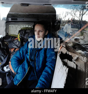 Migrants on Chios Island -  04/01/2016  -  Greece / Cyclades (the) / Chios island  -  Despoina is sitting on the back of the van Stock Photo
