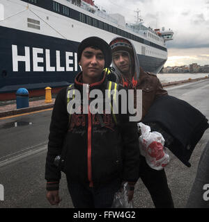 Migrants on Chios Island -  03/01/2016  -  Greece / Cyclades (the) / Chios island  -  Young refugees in front of the ship, that  Stock Photo