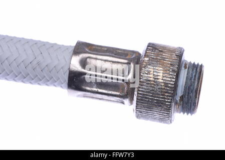 Old flexible metal hose pipe isolated on with white background Stock Photo