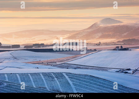 Countryside at sunset in winter - from the top of Dunnideer Hill near the village of Insch, Aberdeenshire, Scotland. Stock Photo