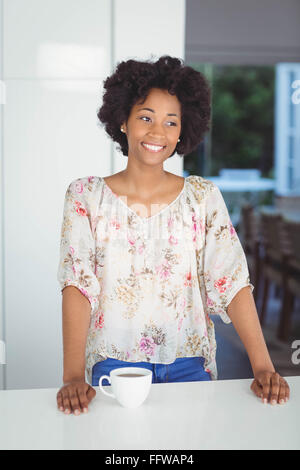 Smiling woman in the kitchen Stock Photo