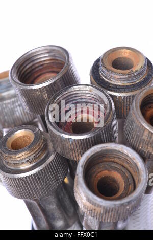 Old plumbing hose pipes isolated on white background Stock Photo