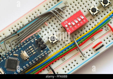 Arduino Pro Mini micro-controller plugged into a breadboard Stock Photo ...