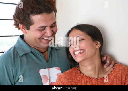 South Asian Indian young man and woman hugging and smiling MR#687Q687R Stock Photo