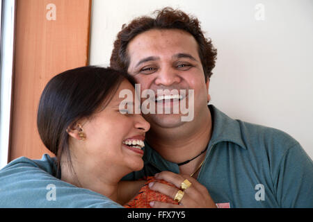 South Asian Indian young man and woman hugging and smiling MR#687Q687R Stock Photo