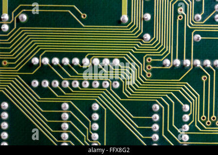 Green electronic printed circuit board PCB yellow tracks Stock Photo