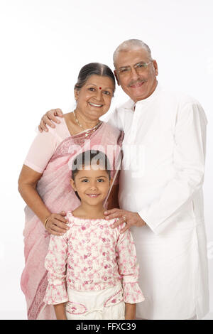 Grandparent and granddaughter standing close to each other MR#703O,703P,703Q Stock Photo