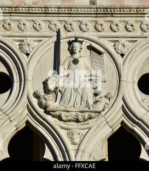 Detail from Doge's Palace western facade with the Goddess of Justice Stock Photo