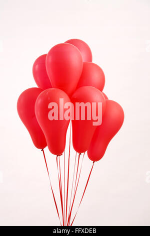 Red balloons with red ribbons Stock Photo