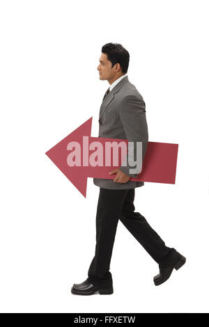 Businessman carrying big size red color paper arrow MR#703T Stock Photo