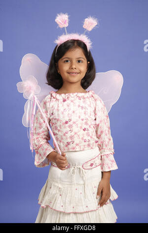 Eight year old girl wearing pink fairy costume MR#703U Stock Photo