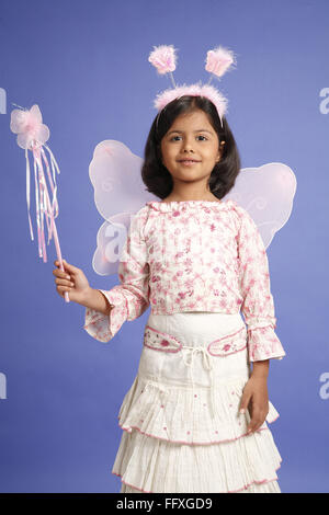 Eight year old girl wearing pink fairy costume MR#703U Stock Photo