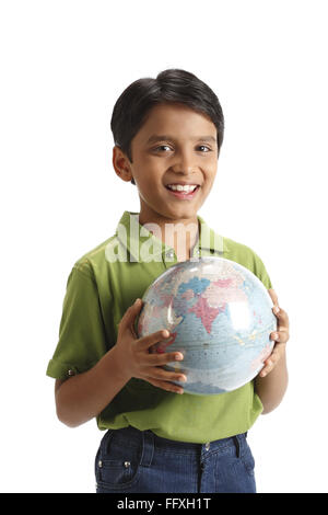 Ten year old boy holding globe in his both hand MR#703V Stock Photo