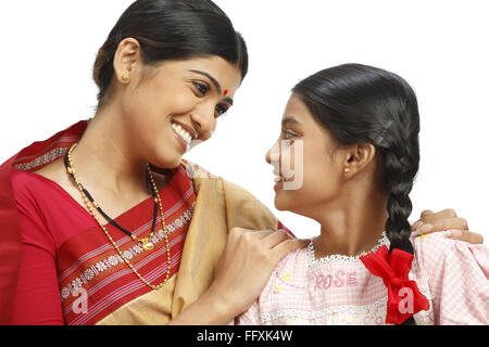 Indian farmer wife and daughter looking at each other MR#743B,743C Stock Photo