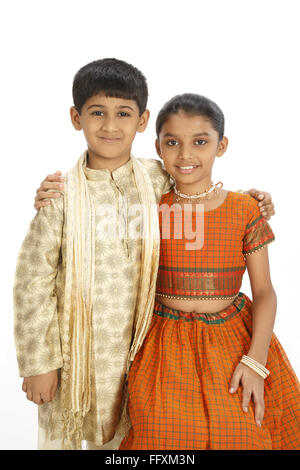 Ten and eight years old boy and girl standing close to each other MR#743C,743D Stock Photo
